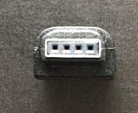 HP serial adapter, close-up on the 4-socket end (a bit blurred).JPG